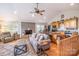 Open-concept living space with fireplace, adjacent kitchen, and hardwood floors at 119 Harbor Ln, Mount Gilead, NC 27306
