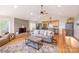 Bright, open living area with hardwood floors, fireplace, and kitchen at 119 Harbor Ln, Mount Gilead, NC 27306