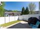 Private backyard with white fence, patio and synthetic turf, perfect for low-maintenance living at 121 Talbert Town Loop, Mooresville, NC 28117