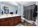 Well-lit bathroom featuring a double sink vanity, framed mirror and modern fixtures at 121 Talbert Town Loop, Mooresville, NC 28117