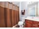 Cozy bathroom with a shower and vanity, enhanced by warm lighting and modern accents at 121 Talbert Town Loop, Mooresville, NC 28117