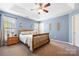 Comfortable bedroom featuring carpeted floors, neutral walls, a ceiling fan, and lots of natural light at 121 Talbert Town Loop, Mooresville, NC 28117