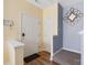 Welcoming foyer with hardwood flooring, neutral paint, decorative mirror, and access to stairs and other rooms at 121 Talbert Town Loop, Mooresville, NC 28117