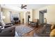 Cozy living room featuring hardwood floors, neutral walls, and comfortable leather seating at 121 Talbert Town Loop, Mooresville, NC 28117