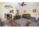 Open-concept living room with hardwood floors seamlessly connects to the kitchen and dining area at 121 Talbert Town Loop, Mooresville, NC 28117
