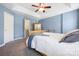 Charming bedroom featuring a ceiling fan, soft blue walls and access to a walk-in closet at 121 Talbert Town Loop, Mooresville, NC 28117