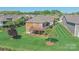 Aerial view of backyard with deck, patio, and manicured lawn in a residential neighborhood at 1231 Restoration Dr, Marvin, NC 28173