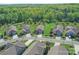 Aerial view of the homes in a community with ponds and mature landscaping at 1231 Restoration Dr, Marvin, NC 28173