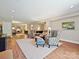 Finished basement with neutral walls, recessed lighting, and an open layout featuring wood-look flooring and seating arrangements at 1231 Restoration Dr, Marvin, NC 28173