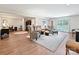 Basement featuring a cozy seating area with floral armchairs, lamps, and an area rug on top of wood floors at 1231 Restoration Dr, Marvin, NC 28173