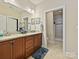 The bathroom features double sinks, granite countertops, and a walk-in shower at 1231 Restoration Dr, Marvin, NC 28173