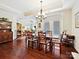 This dining room features hardwood floors, a chandelier, and plenty of space for entertaining guests at 1231 Restoration Dr, Marvin, NC 28173