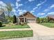 Charming single-Gathering home with a well-maintained lawn and a two-car garage at 1231 Restoration Dr, Marvin, NC 28173