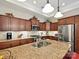 A spacious kitchen featuring granite countertops, stainless steel appliances, and ample cabinet space at 1231 Restoration Dr, Marvin, NC 28173