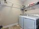 Laundry room with a washer, dryer, shelving and tile floors at 1231 Restoration Dr, Marvin, NC 28173