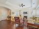 Cozy living room with a fireplace, plush seating, and hardwood floors offering a warm and inviting atmosphere at 1231 Restoration Dr, Marvin, NC 28173