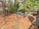 Enclosed patio area for outdoor relaxation, surrounded by lush greenery and a shade tree at 126 Pointer Se Ct, Concord, NC 28025