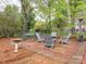 Backyard patio area with brick pavers and outdoor seating, ideal for outdoor gatherings at 126 Pointer Se Ct, Concord, NC 28025
