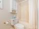 Bathroom view with a white toilet, and a shower and tub combo at 126 Pointer Se Ct, Concord, NC 28025