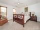 Inviting bedroom with natural light, neutral carpet, and tasteful furnishings at 126 Pointer Se Ct, Concord, NC 28025