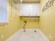 Functional laundry room with ample storage, tiled flooring, and convenient hookups for washer and dryer at 126 Pointer Se Ct, Concord, NC 28025