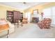 Cozy living room featuring a fireplace, built-in bookcases, and comfortable seating at 126 Pointer Se Ct, Concord, NC 28025
