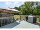 Entertainers deck with pergola, hot tub, fire pit, grill, and a sprawling yard with trees at 140 Misty Ln, Rockwell, NC 28138