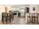 Functional kitchen space featuring white cabinets, appliances, and eat-in dining area at 140 Misty Ln, Rockwell, NC 28138