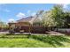 The backyard features a pergola, hot tub, and lush lawn providing a serene outdoor retreat at 1427 Doe Ridge Ln, Fort Mill, SC 29715