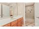 Bathroom featuring a tub shower combo, vanity, large mirror and updated fixtures create a functional space at 1427 Doe Ridge Ln, Fort Mill, SC 29715
