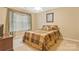 Bedroom with natural light, neutral tones, and simple decor creates a calming and inviting space at 1427 Doe Ridge Ln, Fort Mill, SC 29715