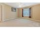 Bedroom with carpet, neutral tones, and a large window provides a blank canvas for personalization at 1427 Doe Ridge Ln, Fort Mill, SC 29715