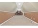 Spacious bonus room with unique ceiling, neutral carpet and two-tone paint, perfect for entertaining at 1427 Doe Ridge Ln, Fort Mill, SC 29715