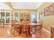 Traditional dining room with wood table, chairs, flooring and lots of natural light from the windows at 1427 Doe Ridge Ln, Fort Mill, SC 29715