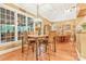 Bright dining room with large windows and wood floors, seating for Gathering dinners at 1427 Doe Ridge Ln, Fort Mill, SC 29715