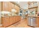 Kitchen with light wood cabinets, stainless appliances and granite countertops at 1427 Doe Ridge Ln, Fort Mill, SC 29715