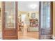 Shot of a living room with hardwood floors and doorway with windows providing the shot at 1427 Doe Ridge Ln, Fort Mill, SC 29715