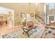 Inviting living room with a staircase decorated with a garland and a glimpse into other rooms at 1427 Doe Ridge Ln, Fort Mill, SC 29715