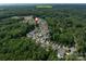Beautiful aerial view of Davidson College neighborhood surrounded by lush green trees at 1550 Matthew Mcclure Cir, Davidson, NC 28036