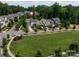 Neighborhood aerial view showcasing well-manicured lawns, mature trees, and a cul-de-sac street at 1550 Matthew Mcclure Cir, Davidson, NC 28036