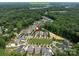 Serene aerial view of homes in River Run Country Club neighborhood with lawns and mature trees at 1550 Matthew Mcclure Cir, Davidson, NC 28036