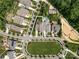 Stunning aerial view of a neighborhood with well-maintained lawns and beautiful homes with neighborhood pool at 1550 Matthew Mcclure Cir, Davidson, NC 28036