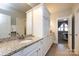 Bathroom with granite countertop vanity and access to bedroom at 1550 Matthew Mcclure Cir, Davidson, NC 28036