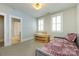 Cozy bedroom with decorative lighting, twin bed, and attached bathroom at 1550 Matthew Mcclure Cir, Davidson, NC 28036