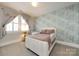 Bright bedroom features swan wallpaper, large windows and a comfortable bed at 1550 Matthew Mcclure Cir, Davidson, NC 28036