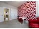 Bright bedroom with colorful floral wallpaper and white table and chairs at 1550 Matthew Mcclure Cir, Davidson, NC 28036