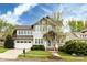 Charming two-story home with a well-maintained lawn, attached garage, and inviting front porch at 1550 Matthew Mcclure Cir, Davidson, NC 28036