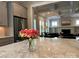 Open kitchen design with stainless steel appliances, view into the adjacent living room, and marble island at 1550 Matthew Mcclure Cir, Davidson, NC 28036