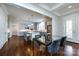 Open-concept kitchen with gray cabinets, stainless steel appliances, an island, and hardwood floors at 1550 Matthew Mcclure Cir, Davidson, NC 28036