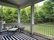 Comfortable screened porch overlooking the lush green backyard at 1550 Matthew Mcclure Cir, Davidson, NC 28036